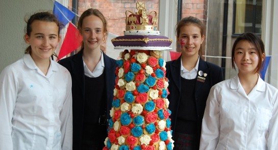 Harrogate Ladies’ College pupils with their Queen’s 90th Birthday cake